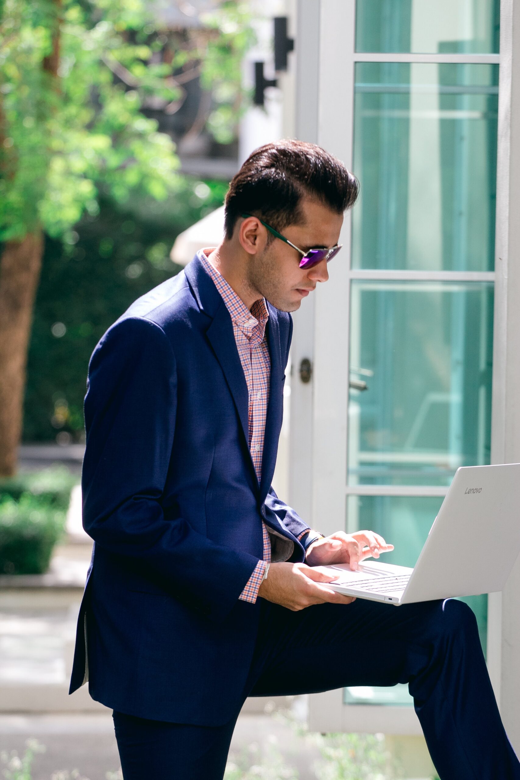 Tailor working on a bespoke suit in the workshop